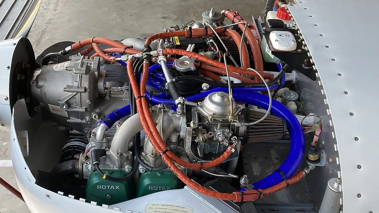 Installed ROTAX engine overview showing hose routing and installed-system context