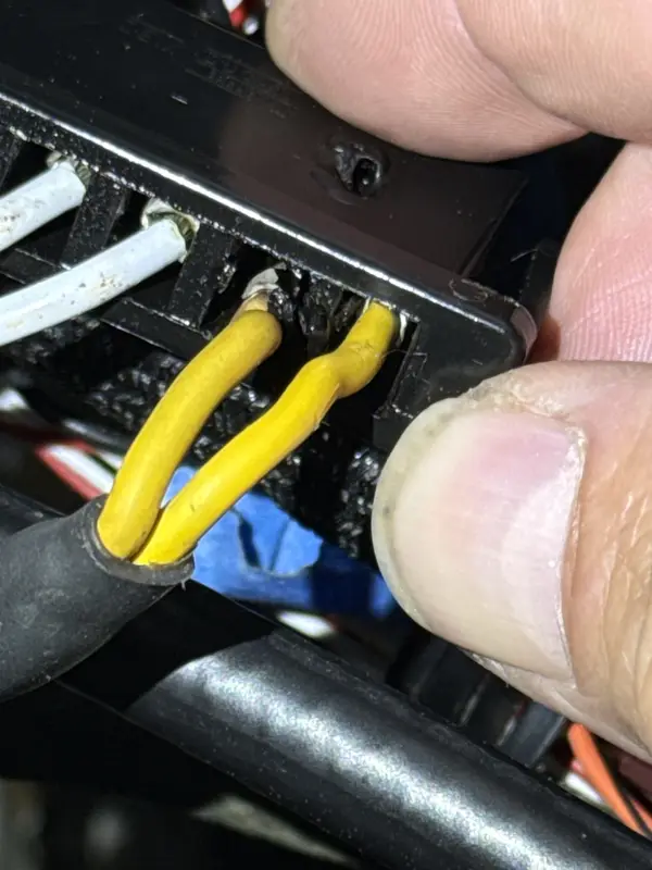 Close view of an aircraft electrical connector during inspection