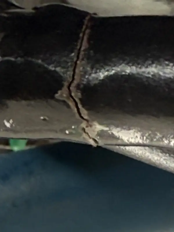 Close view of an engine cage crack before coordinated repair