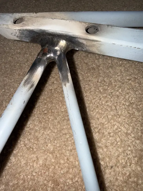 Close view of an engine cage weld joint after coordinated work