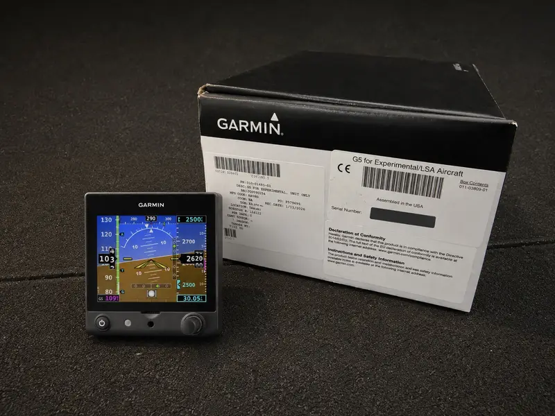 Garmin G5 flight display beside its product box